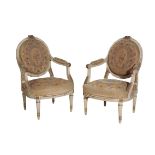 A PAIR OF CARVED, PAINTED AND PARCEL GILTWOOD FAUTEUILS, IN LOUIS XV TRANSITIONAL STYLE,