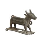 A BRONZE MODEL OF A BULL,