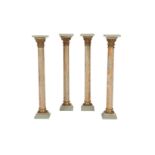 A SET OF FOUR EGYPTIAN STRIATED ALABASTER AND GILT BRONZE MOUNTED COLUMNAR PEDESTALS,