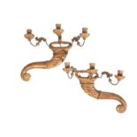 A PAIR OF ITALIAN CARVED AND GILTWOOD THREE LIGHT WALL APPLIQUES,