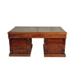 A VICTORIAN WALNUT PARTNERS' DESK,