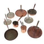 A VICTORIAN COMPOSITE COPPER AND IRON HANDLED PART BATTERIE DE CUISINE,