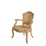 A CARVED AND GILTWOOD FAUTEUIL , IN LOUIS XV STYLE,