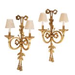 A PAIR OF SUBSTANTIAL GILT METAL TWIN LIGHT WALL APPLIQUES IN LOUIS XVI TASTE,