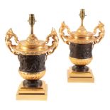 A PAIR OF GILT AND PATINATED BRONZE URN TABLE LAMPS,