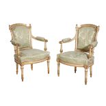 A PAIR OF CARVED, PAINTED AND PARCEL GILTWOOD FAUTEUILS, IN LOUIS XVI STYLE,