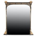 A VICTORIAN EBONISED AND PARCEL GILTWOOD AND COMPOSITION OVERMANTEL MIRROR,