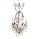 A PATINATED METAL AND GLASS HUNG SIX LIGHT CHANDELIER, IN LOUIS XV TASTE,