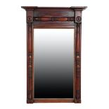 A REGENCY CARVED AND STAINED WALNUT FRAMED PIER MIRROR,