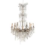 A GILT METAL AND GLASS ADORNED TWELVE LIGHT CHANDELIER,