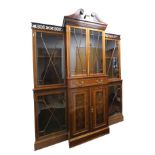 AN EDWARDIAN MAHOGANY, MARQUETRY AND GLAZED BREAKFRONT BOOKCASE, IN CHIPPENDALE TASTE,