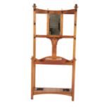 AN EDWARDIAN OAK AND METAL MOUNTED HALL STAND, IN ARTS AND CRAFTS STYLE,