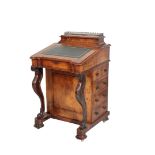 A VICTORIAN WALNUT DAVENPORT,