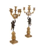 A PAIR OF RESTAURATION GILT AND PATINATED BRONZE FIGURAL FIVE LIGHT CANDELABRA,