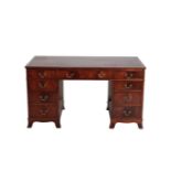 A MAHOGANY PEDESTAL DESK IN GEORGE III STYLE,