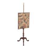 A LATE GEORGE II OR GEORGE III MAHOGANY POLE SCREEN,