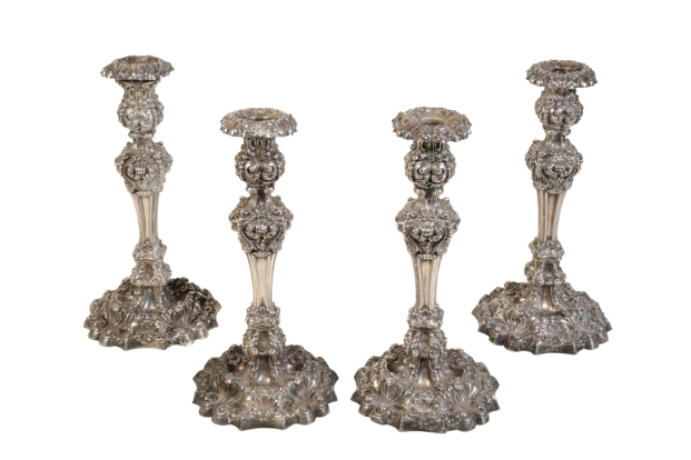 A SET OF FOUR MATCHED GEORGE IV CANDLESTICKS