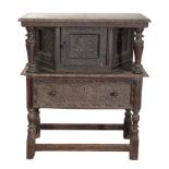 A CARVED OAK COURT CUPBOARD, IN JAMES I CENTURY STYLE,