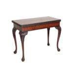 A GEORGE II CARVED MAHOGANY CARD TABLE,