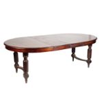 A FRENCH WALNUT EXTENDING DINING TABLE,