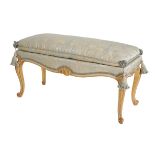 A CARVED GILTWOOD AND UPHOLSTERED STOOL IN LOUIS XV STYLE,