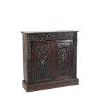 A VICTORIAN CARVED OAK SIDE CABINET