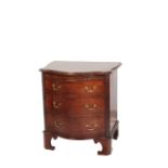 A MAHOGANY SERPENTINE FRONT CHEST OF DRAWERS, IN GEORGE III STYLE,