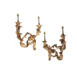 TWO PAIRS OF GILT COMPOSITION THREE LIGHT WALL APPLIQUES, IN LOUIS XV STYLE,