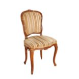 A CARVED BEECH AND UPHOLSTERED SIDE CHAIR, IN LOUIS XV STYLE,