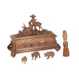 A 'BLACK FOREST' CARVED AND STAINED LINDEN WOOD BOX AND A CACHE POT WITH A BEAR,