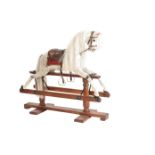 A LATE VICTORIAN OR EDWARDIAN PAINTED WOOD ROCKING HORSE,