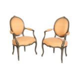 A PAIR OF PAINTED WOOD AND UPHOLSTERED FAUTEUILS, IN LOUIS XV STYLE,