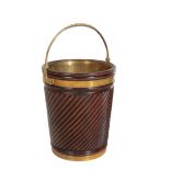 A MAHOGANY PEAT BUCKET, IN IRISH 18TH CENTURY TASTE,