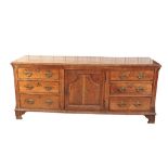 AN EARLY GEORGE III OAK DRESSER,