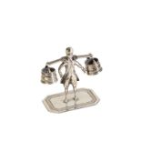 A DUTCH SILVER MINIATURE OF A WATER CARRIER