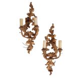 A PAIR OF CONTINENTAL CARVED AND GILTWOOD TWIN LIGHT WALL APPLIQUES, IN 18TH CENTURY STYLE,