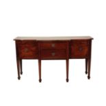 A GEORGE III MAHOGANY BREAKFRONT SIDEBOARD,