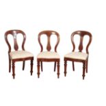 A SET OF EIGHT VICTORIAN MAHOGANY BALLOON BACK DINING CHAIRS,