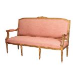 A CARVED AND GILTWOOD AND UPHOLSTERED CANAPÃ‰ IN LOUIS XVI STYLE,