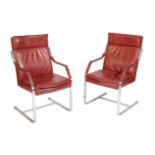 A SET OF FOUR CHROME AND RED LEATHER CANTILEVER ELBOW CHAIRS