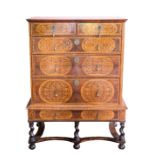 A QUEEN ANNE OYSTER VENEERED AND SEAWEED MARQUETRY CHEST ON STAND