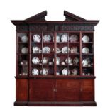 A GEORGE II MAHOGANY BREAK-FRONT LIBRARY BOOKCASE