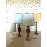 A TURNED AND PAINTED WOODEN TABLE LAMP WITH SHADE