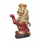 A CARVED GILTWOOD AND POLYCHROME HERALDIC LION