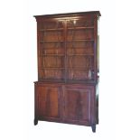 A REGENCY MAHOGANY BOOKCASE CABINET