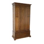 AN ARTS AND CRAFTS OAK SINGLE WARDROBE,