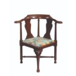 A GEORGE II WALNUT CORNER CHAIR