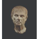 A MONUMENTAL ROMAN MARBLE HEAD OF A MAN