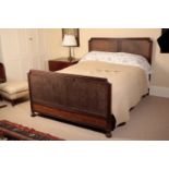 A MAHOGANY AND CANEWORK DOUBLE BED, BY HEAL & SON,