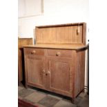 AN OAK KITCHEN SIDEBOARD, IN ARTS AND CRAFTS STYLE, BY HEAL & CO.,